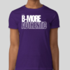 The B-More Authentic t-shirt features boxed text which spells out an abbreviated version of the word Baltimore. An altered version of the BHS logo is applied to the back of the t-shirt.