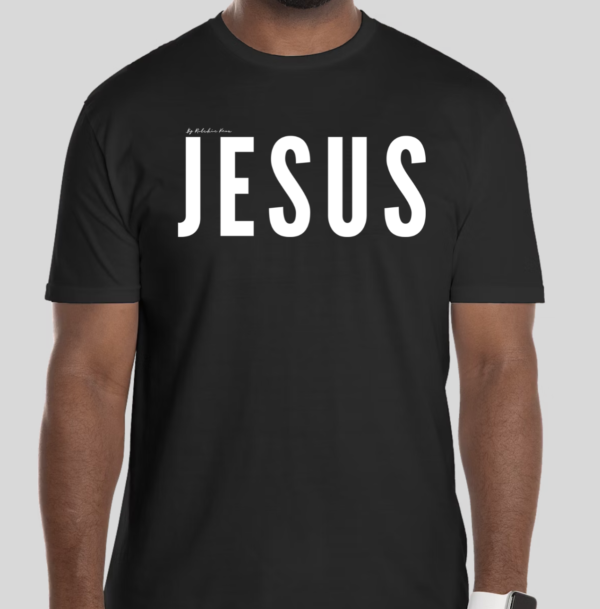 Black t-shirt with the word 'Jesus' in bold white letters on the front; back features Broken Heart Shirts logo with a 'B', broken heart icon, and 'S'.