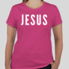 Pink t-shirt with the word 'Jesus' in bold white letters on the front; back features Broken Heart Shirts logo with a 'B', broken heart icon, and 'S'.